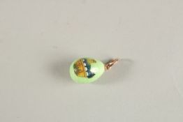 A 14CT GOLD CHICKEN ENAMEL EGG PENDANT.
