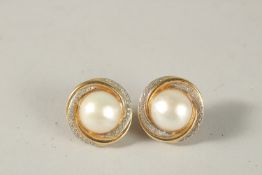 A GOOD PAIR OF 14CT GOLD PEARL AND DIAMOND EARRINGS. 2cms diameter.