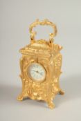 A MINI CAST METAL ORNATE CARRIAGE CLOCK. 7cms high.