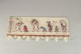 A CLOTHES HOOK, cast iron with dogs. 50cms long.