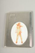 AN ENGINE TURNED SILVER CIGARETTE CASE. Birmingham 1937, with a glamour model enamel.