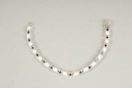 A SILVER OPAL AND SAPPHIRE LINE BRACELET.