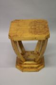 AN ART DECO DESIGN MAPLE WOOD SQUARE TABLE with curving legs and platform base. 50cms wide x 56cms