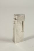 A DUNHILL SILVER LIGHTER.