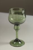 A GEORGIAN AMBER GLASS WINE GLASS. 14cms high.