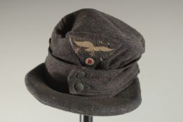 A GERMAN LUFTWAFFE CLOTH PEAK CAP, 1942.