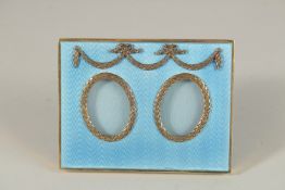 A VERY GOOD RUSSIAN SILVER AND BLUE ENAMEL PHOTOGRAPH FRAME. Marks: E. K. Faberge Head 84. 10cms x