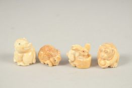 FOUR CARVED BONE NETSUKES.