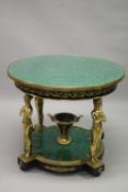A GOOD LOUIS XVITH STYLE CIRCULAR MALACHITE CENTRE TABLE with four gilt classical figure supports