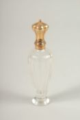 A GOLD TOP GLASS SCENT BOTTLE. 10cms long.