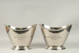 A PAIR OF OVAL CHROME WINE COOLERS 