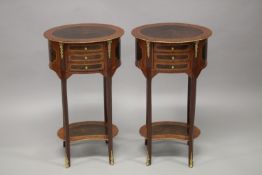 A PAIR OF LOUIS XVITH STYLE OVAL INLAID BEDSIDE TABLES with three small drawers, curving legs and