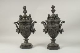 A VERY GOOD PAIR OF CLASSICAL BRONZE TWO-HANDLED URNS AND COVERS, with busts, putti, ribbons and