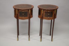 A PAIR OF LOUIS XVITH STYLE MAHOGANY OVAL BEDSIDE TABLES with three small drawers supported on