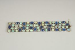 A GOOD SILVER SET OPAL, DIAMOND AND TANZANITE BRACELET with gold clasp.