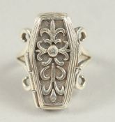 A SILVER COFFIN RING.