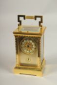 A GOOD GILT BRONZE REPEATING CARRIAGE CLOCK with alarm. 14cms high.