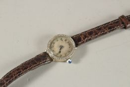 A LADIES' WHITE GOLD AND DIAMOND COCKTAIL WATCH.