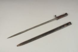 A K98 LONG BAYONET, the handle numbered 59P, the blade in a metal sheath. 69cms long.