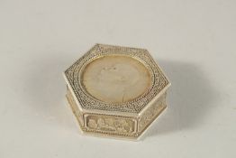 A CHINESE OCTAGONAL COIN BOX. 5cms.