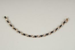 A 9CT GOLD, DIAMOND AND SAPPHIRE BRACELET.