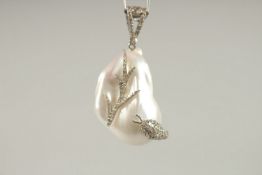 A SILVER SET BAROQUE PEARL AND DIAMOND SET PENDANT on chain.