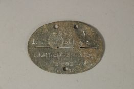 A WWII DOG TAG 1ST REG. NO. 5652.