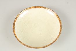 A CHINESE DING WARE BOWL. 20cms diameter.