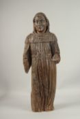 AN EARLY 16TH CENTURY CARVED WOOD STANDING SAINT. 76cms high.