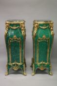 A SUPERB LARGE PAIR OF LOUIS XVITH DESIGN MALACHITE PEDESTALS with gilt mounts, lion's heads, shells