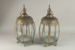 A PAIR OF COPPER HANGING LANTERNS.