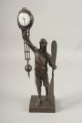 AN AIRMAN BRONZED SWING CLOCK. 34cms high