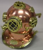 A REPLICA COPPER DIVER'S HELMET.