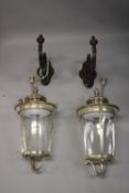 A PAIR OF LARGE SILVERED METAL WARE LIGHTS, of tapering circular form with perspex glazing, complete