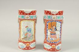 A PAIR OF JAPANESE IMARI CIRCULAR VASES. 26cms high.