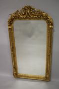 A GOOD LOUIS XVITH GILTWOOD UPRIGHT MIRROR with cupids, acanthus and scrolls. 150cms high x 80cms
