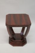 AN ART DECO DESIGN DARK WOOD SQUARE TABLE with curving legs and platform base. 50cms wide x 56cms