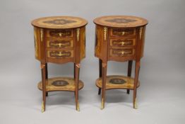 A PAIR OF LOUIS XVITH DESIGN INLAID OVAL BEDSIDE TABLES with three drawers, on curving legs. 73cms