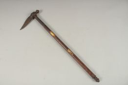 A 17TH CENTURY INDIAN MACE with wooden handle. 58cms long.