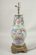 A GOOD CANTON PORCELAIN LAMP on a gilt base. Lamp: 30cms high.