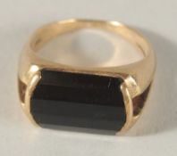 A 9CT GOLD SIGNET RING.