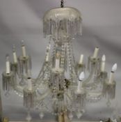 A GOOD LARGE CUT GLASS TWELVE BRANCH, TWO-TIER CHANDELIER with cut glass prisms and drops. 3ft