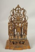 A TIBETAN GILT BRONZE SHRINE with three figures. 28cms high.