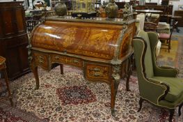 A GOOD LARGE LOUIS INLAID CYLINDER BUREAU with bronze figure heads and folding cylinder front and