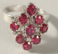 A GOOD RUBY AND DIAMOND CLUSTER RING. No. V 12465.