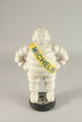 A CAST IRON MICHELIN MAN. 40cms high.