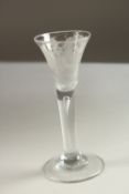 A GOOD GEORGIAN WINE GLASS, the bowl engraved with FIAT and roses and tear drop stem. 15cms high.