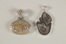 TWO SILVER PENDANTS.