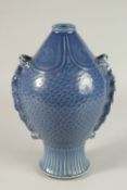 A CHINESE BLUE FISH SHAPED VASE. 32cms high.