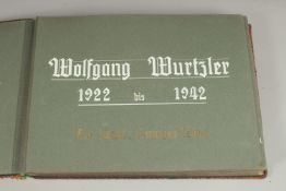 A GERMAN PHOTOGRAPH ALBUM FOR WOLFGANG MURTZLER FROM 1917 - 1942.